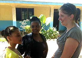 Julia talking to Teacher Agnes (center).