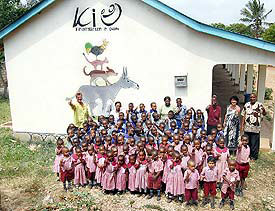 all of our children on one photo: our kindergarteners in red uniforms, and our school children in blue.